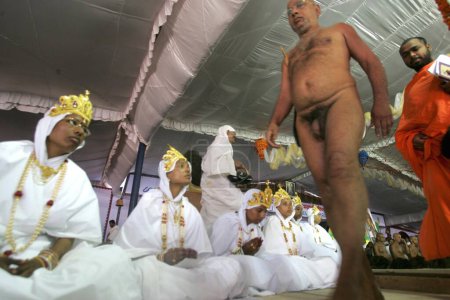 Photo for Naked sadhu leading the procession of deeksha. initiation ceremony to  become sadhvis at Mahamasthakabhisheka Jain festival. Shravanabelagola. Hassan district. Karnataka state. India - Royalty Free Image