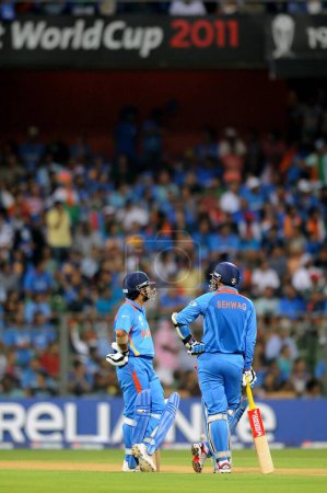 Photo for Indian opening batsman Sachin Tendulkar Virendra Sehwag during the 2011 ICC World Cup Final between India and Sri Lanka at Wankhede Stadium on April 2 2011 in Mumbai India - Royalty Free Image
