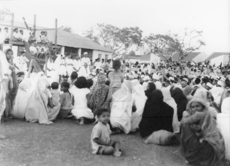 Photo for Mahatma Gandhi at a prayer meeting during Mahatma Gandhis fast at Rashtriyashala Ashram. Rajkot. 1939 . India - Royalty Free Image