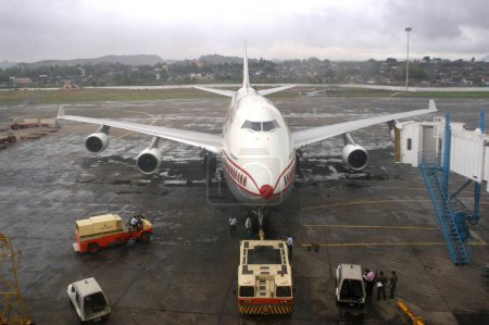 Photo for Aeroplane, Air Indias Boeing 747 bus being brought on the runway at the Chhatrapati Shivaji International Airport Terminal 2C, in Bombay, now Mumbai city, Maharashtra, India - Royalty Free Image