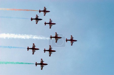 Photo for Indian Air Force precision flying team Suryakiran perform with eight planes during air show at Marine Drive in Bombay now Mumbai  ; Maharashtra ; India - Royalty Free Image