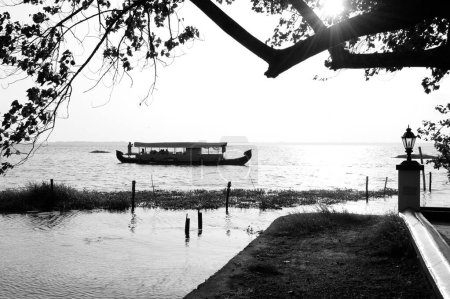 Photo for Boat and old lamp, Vembanad lake, Coconut Lagoon Resort, Kumarakom, Kottayam, Kerala, India, Asia - Royalty Free Image