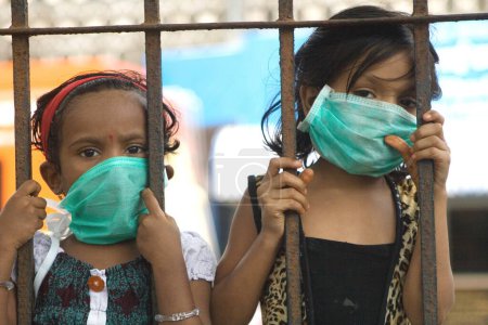 Photo for Girls wearing mask avoiding swine flu, Bombay Mumbai, Maharashtra, India - Royalty Free Image
