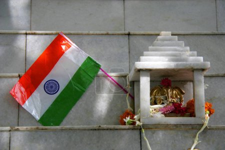 Photo for Indian Flag placed at temple of Lord Ganesh, elephant headed God, on Independence Day 15th August 2005, suggesting India as religious country - Royalty Free Image