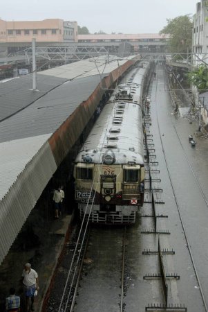 Photo for Local train at flooded railway tracks at western railway ; Dadar ; Mumbai Bombay ; Maharashtra ;  India - Royalty Free Image