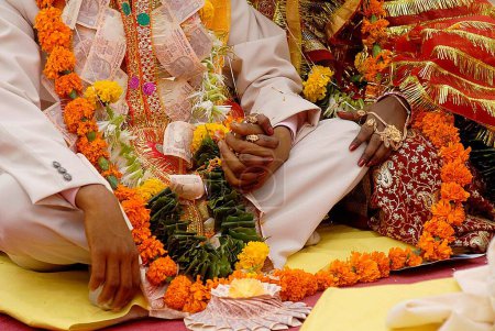 Photo for Couples getting married at mass marriage function organized by Sant Nirankari Mission at Airoli. New Bombay now Navi Mumbai. Maharashtra. India - Royalty Free Image