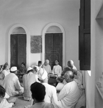 Photo for Mahatma Gandhi in a meeting at Delhi, 1946, Sharad Bose, Pyarelal Nayar, Mirabehn, India - Royalty Free Image