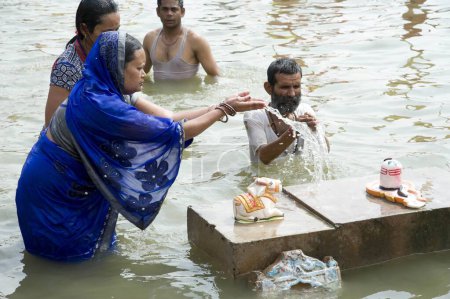 Photo for Woman offering water on shivling, ujjain, madhya pradesh, india, asia - Royalty Free Image