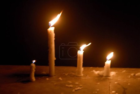 Photo for Candles of wax illuminated for celebrating Gudi Padva Festival ; New year of Hindu religion ; Masunda Tank ; Thane ; Maharashtra ; India - Royalty Free Image