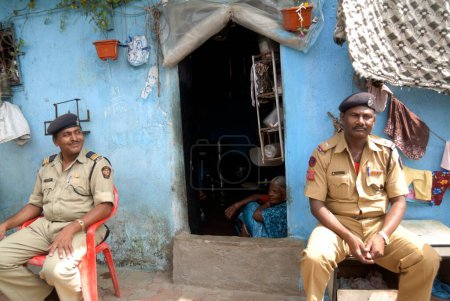 Photo for 24th September 2008, Police personnel take guard in Dalit colony on background of verdict in massacre of Dalit family; Bombay Mumbai, Maharashtra, India - Royalty Free Image