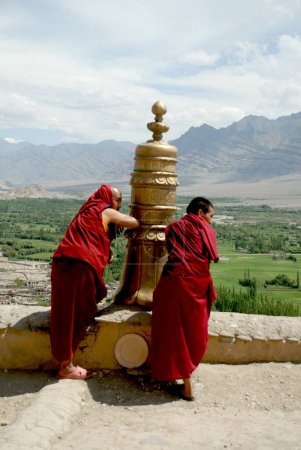 Photo for Lamas blowing horns at Thiksey Monastery at Leh ; Ladakh ; Jammu & Kashmir ; India - Royalty Free Image