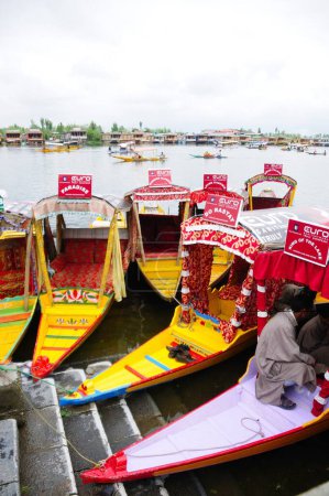Photo for Canoe shikaras at dal lake , Srinagar , Jammu and Kashmir , India - Royalty Free Image