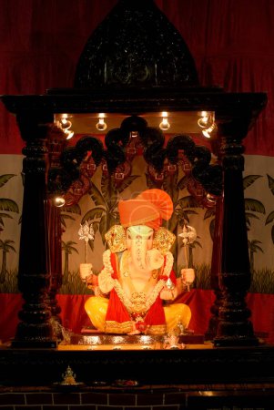 Photo for Idol of Lord Ganesh wearing turban ; worshiping for Ganapati festival ; elephant headed god of Hindu ; Pune ; Maharashtra ; India - Royalty Free Image