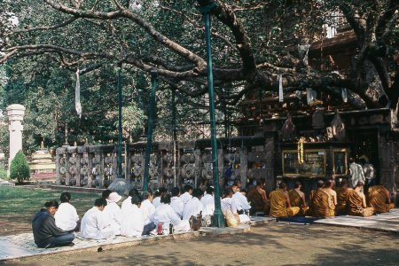 Photo for Tourists listening prayers, Bodh Gaya, Bihar, India, Asia - Royalty Free Image