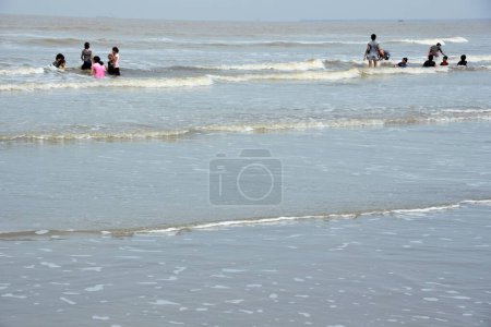 Photo for Tourists bathing, Ubharat beach, Navsari, Gujarat, India, Asia - Royalty Free Image