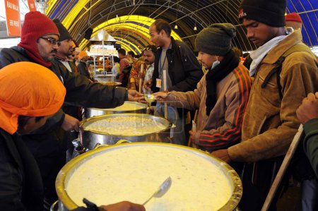 Photo for Man serving food, amarnath yatra, Jammu Kashmir, India, Asia - Royalty Free Image