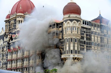 Photo for Fire inside the Taj Mahal hotel ; after terrorist attack by Deccan Mujahedeen on 26th November 2008 in Bombay Mumbai ; Maharashtra ; India - Royalty Free Image