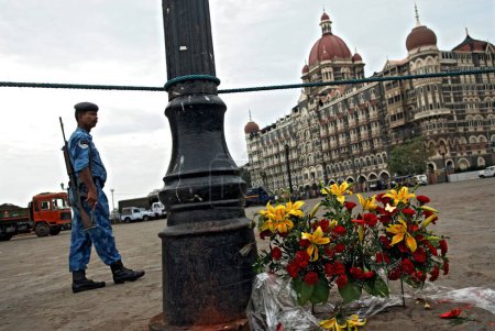 Photo for People offered flowers near Taj mahal hotel paying homage to victims after terrorist attack by deccan mujahedeen, Bombay Mumbai, Maharashtra, India 30, November, 2008 - Royalty Free Image