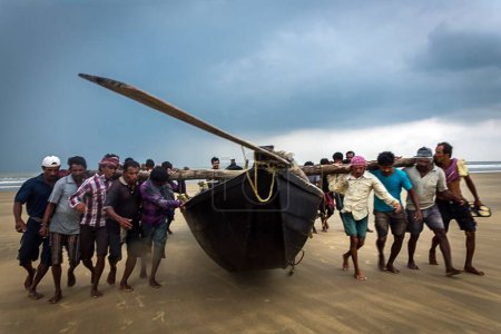 Photo for Fishermen carrying heavy boat, kolkata, west Bengal, India, Asia - Royalty Free Image