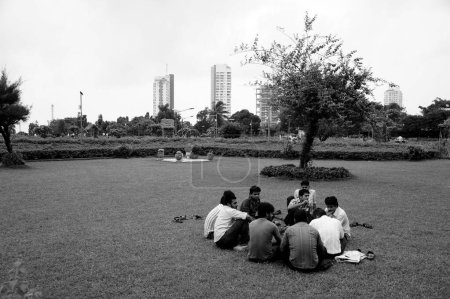 Photo for Boys relaxing, Pherozeshah Mehta Garden, Hanging Gardens, Malabar Hill, Mumbai, Maharashtra, India, Asia - Royalty Free Image