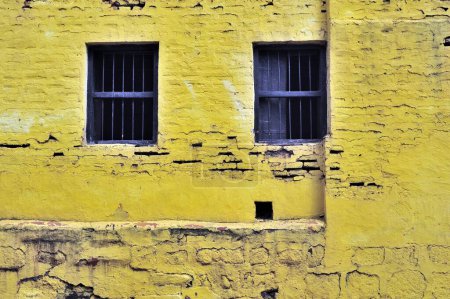 Photo for Old window on yellow brick wall paithan aurangabad maharashtra india Asia - Royalty Free Image