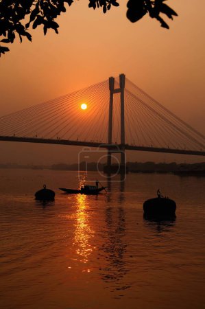 Photo for Sunset Over Hooghly River Howrah Bridge Calcutta West Bengal India Asia - Royalty Free Image