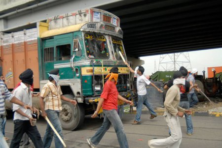 Photo for Sikhs blocking highway protesting for dera saccha sauda at, Mulund, Bombay, Mumbai, Maharashtra, India - Royalty Free Image