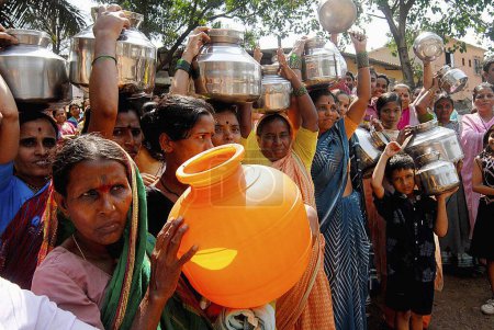 Photo for Women with their stainless steel water containers to protest against the acute water shortage in Bombay now Mumbai, Maharashtra, India - Royalty Free Image