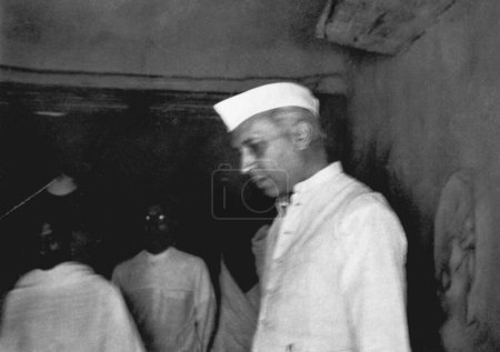 Photo for Jawaharlal Nehru in Mahatma Gandhis hut at Sevagram Ashram, March 1948 - Royalty Free Image