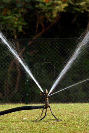 Water sprinkler with rotary nozzle at Saras Baug ; Pune ; Maharashtra ; India