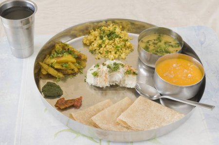 Gujarati food including various items steel plate Pune Maharashtra India Asia