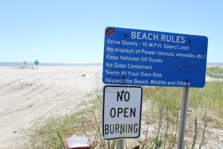 Lafayette, Louisiana, USA, October 2017: Beach in Lafayette, where the access with a car is allowed. Rules are given on a blue sign, like the speed limit, no display of power or keeping off dunes. 