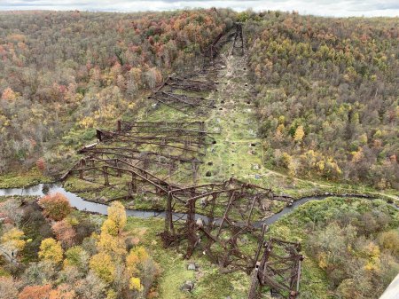 Debris of Kinzua Bridge, former railway bridge of Erie Railroad in Mount Jewett, McKean County, Pennsylvania. The bridge collapsed due to a tornado in 2003. Fall Foliage, sunlight, tornado damage