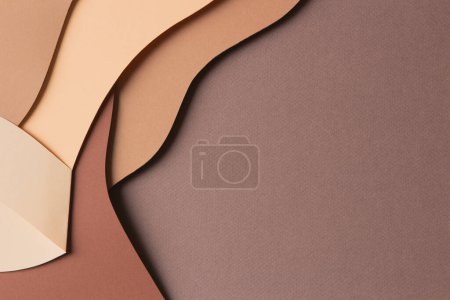 Photo for Abstract colored paper texture background. Minimal paper cut style composition with layers of geometric shapes and lines in shades of beige and brown colors. Top view, copy space - Royalty Free Image