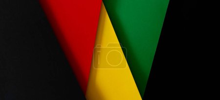 Black History Month celebration. Abstract geometric black, red, yellow, green color paper banner background.