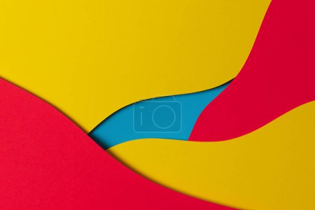 Photo for Abstract colored paper texture background. Minimal paper cut style composition with layers of geometric shapes and lines in yellow, red and light blue colors. Top view. - Royalty Free Image
