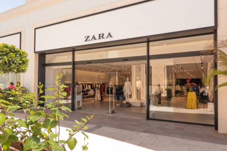 Photo for Orihuela Costa, Alicante, Spain - April 12, 2023: ZARA logo advertising sign above store entrance. Zara is multinational fashion retailer known for fast-fashion clothing for men, women, children. - Royalty Free Image