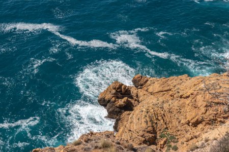 Photo for Beautiful aerial view on blue turquoise Mediterranean sea and rocks from above near Albir lighthouse, Serra Gelada national park, Alicante province, Spain. - Royalty Free Image