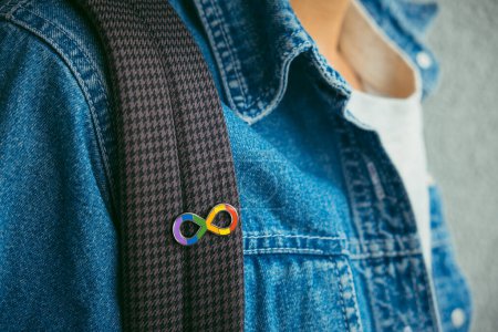 Photo for Young boy with autism infinity rainbow symbol sign. World autism awareness day, autism rights movement, neurodiversity, autistic acceptance movement. - Royalty Free Image