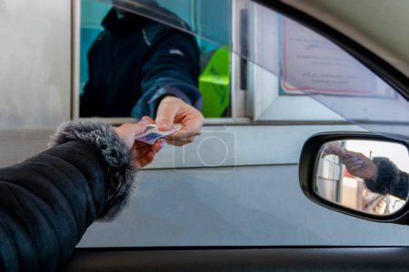 Female driver making payment by card