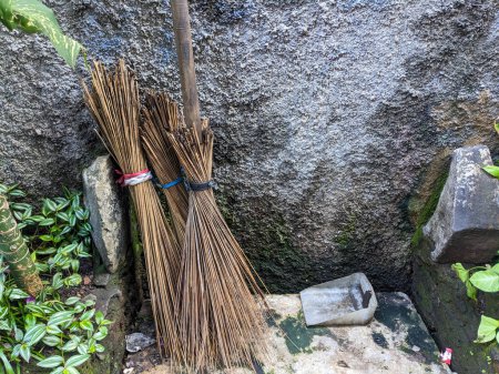 Broomsticks are a tool for cleaning the yard, broomsticks are made from coconut leaves.