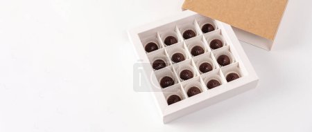 Photo for Belgian chocolate, candies in a craft box, homemade, on a white background, gift, place for text, banner - Royalty Free Image