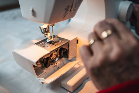 Photo for Sewing machine detail before being used to sew dress clothes - Royalty Free Image