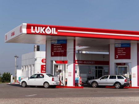 Photo for BUZAU, ROMANIA - SEPTEMBER 22, 2019. Lukoil gas station with fueling car - Royalty Free Image