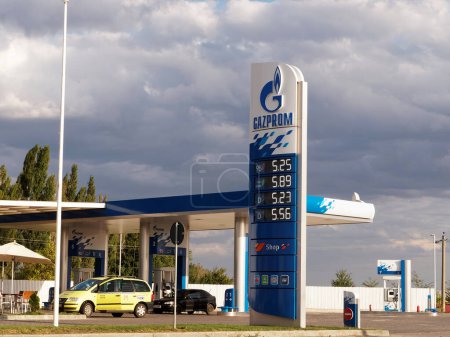 Photo for BUZAU, ROMANIA - SEPTEMBER 10, 2015. Gazprom gas station with fueling car - Royalty Free Image