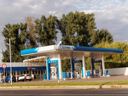 Photo for BUZAU, ROMANIA - SEPTEMBER 10, 2015. Gazprom gas station with fueling car - Royalty Free Image