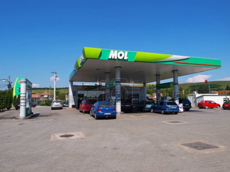 Photo for LUDUS, ROMANIA - AUGUST 20, 2016. MOL gas station with fueling car. - Royalty Free Image