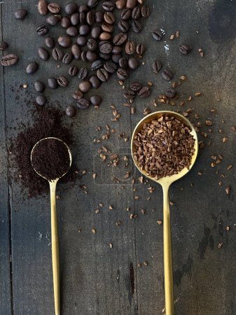 Flat lay of different types of coffee isolated on dark background and gold spoons