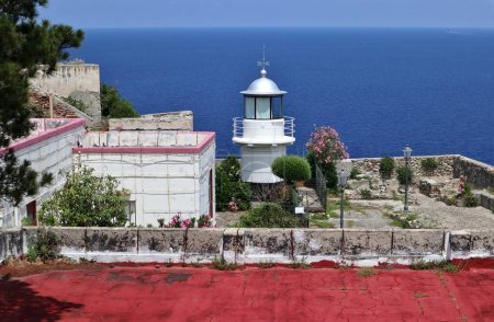Scilla, Calabria, Italy  June 13, 2021: Navy lighthouse on a terrace of Castello Ruffo