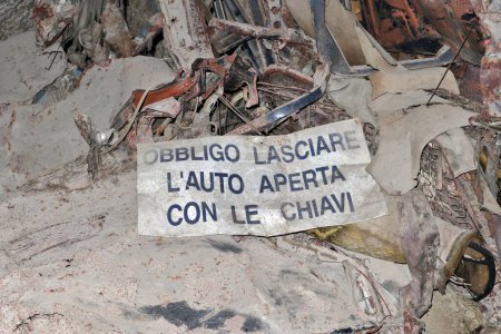 Photo for Naples, Campania, Italy  April 15, 2022: Valet sign on old car wrecks in Galleria Borbonica - Royalty Free Image